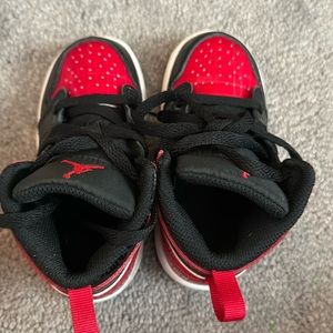 Black and red toddler Jordan 1’s